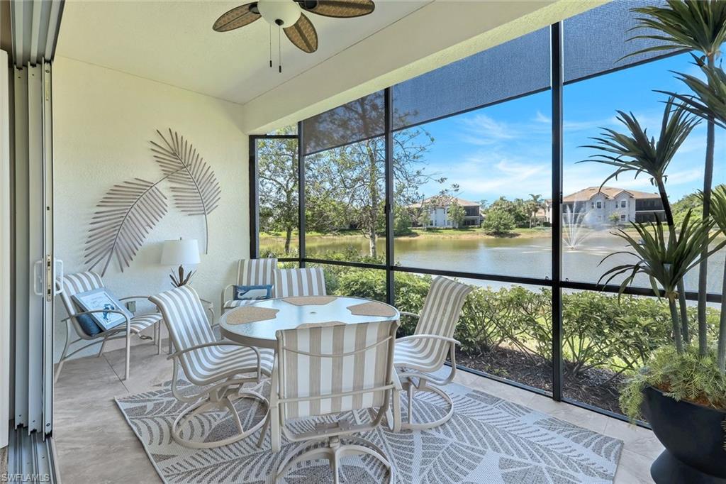 19620 Marino Lake Circle, Unit 2802 Fort Myers, FL 33913 - Photo 6 of 38 Screened Lanai overlooking water for your morning coffee or casual meals or just relaxing. ceiling fan, and a water view