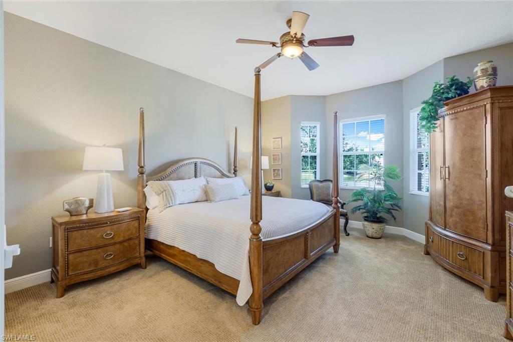 19620 Marino Lake Circle, Unit 2802 Fort Myers, FL 33913 - Photo 10 of 38 Bedroom featuring baseboards, ceiling fan, and light colored carpet