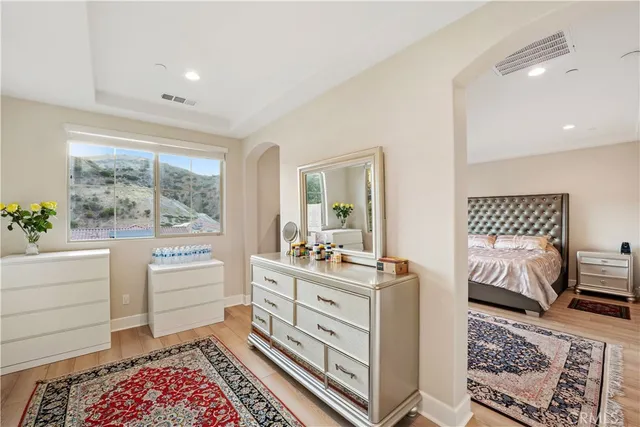 a living room with a bed and a window