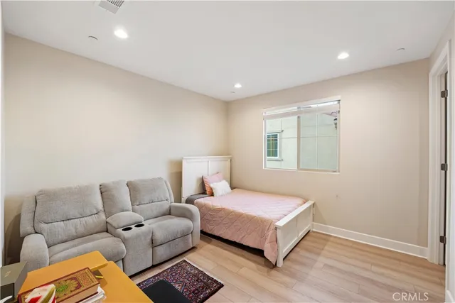 a bathroom with a bathtub shower sink vanity and toilet