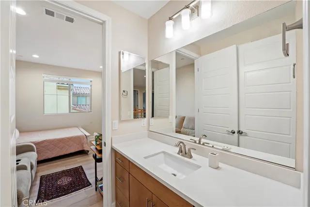 a view of a patio with dining table and chairs with wooden floor