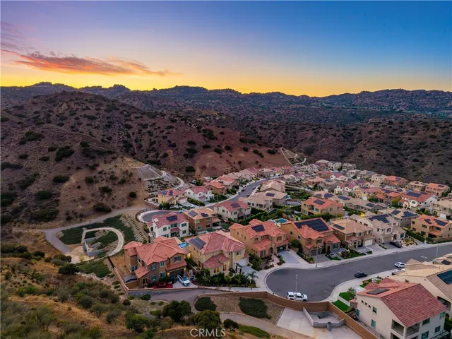 an aerial view of residential houses and street