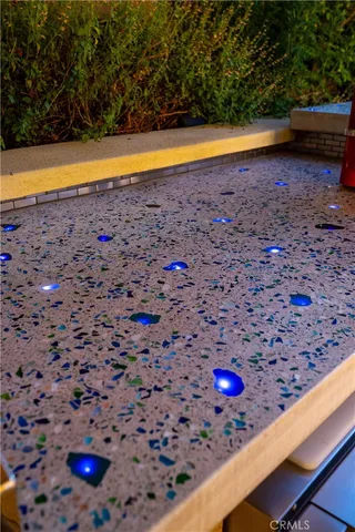 a view of a patio with a table and chairs