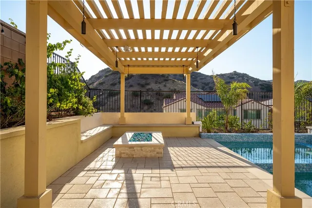 a view of a house with pool and a yard