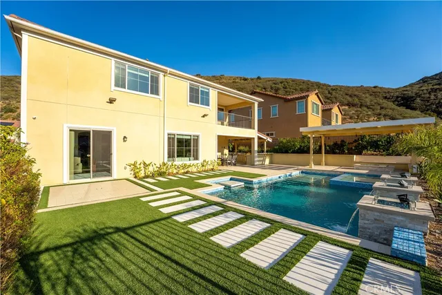 a view of building with a swimming pool