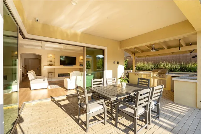 a swimming pool with outdoor seating