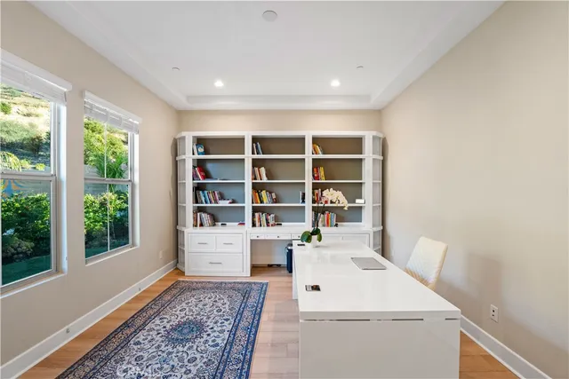 a view of workspace with furniture and white walls