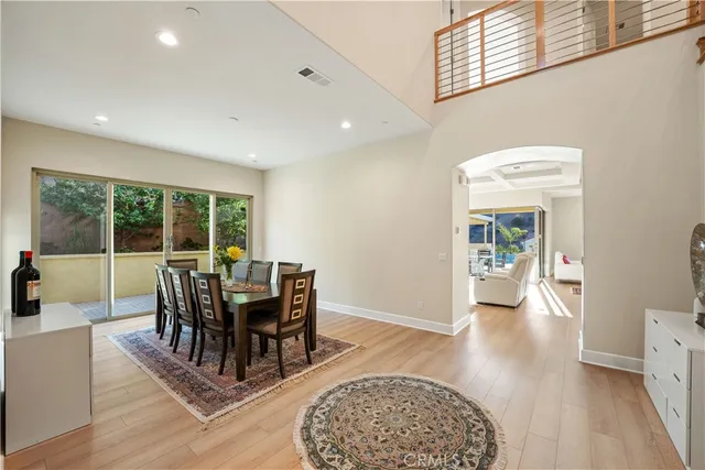 a view of a livingroom with furniture wooden floor and a rug