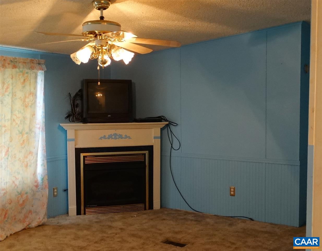 1465 Race Ground Road Rochelle, VA 22738 - Photo 4 of 9 a view of a livingroom with a fireplace