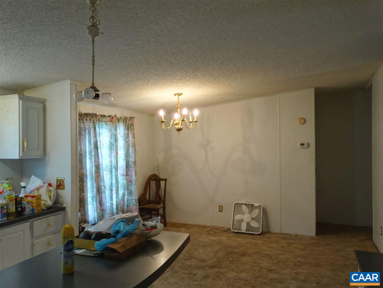 1465 Race Ground Road Rochelle, VA 22738 - Photo 6 of 9 a room with furniture and a chandelier