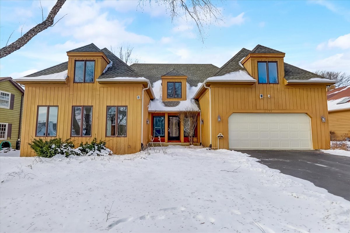 a front view of a house with yard