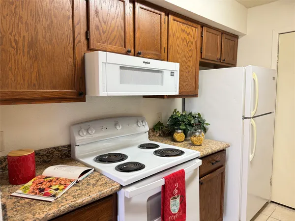 a kitchen with a stove and a refrigerator
