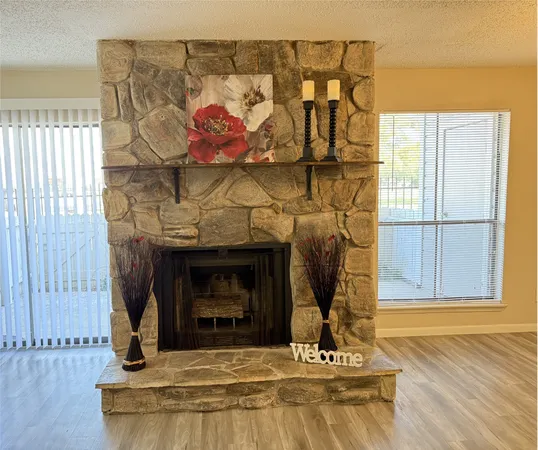 a view of fireplace and wooden floor