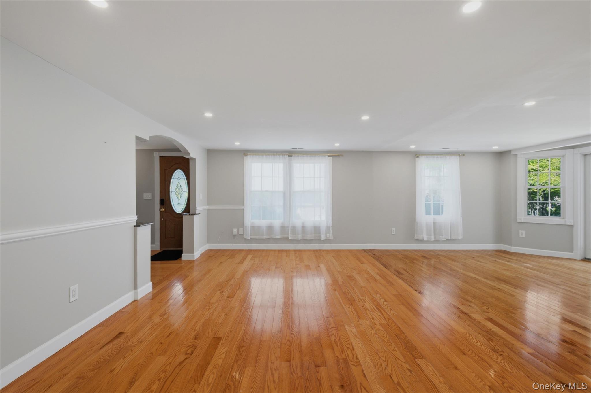 12 Leeside Road Carmel, NY 10512 - Photo 13 of 44 Spacious family room area featuring wood-finish flooring, recessed lighting, and a neutral color palette