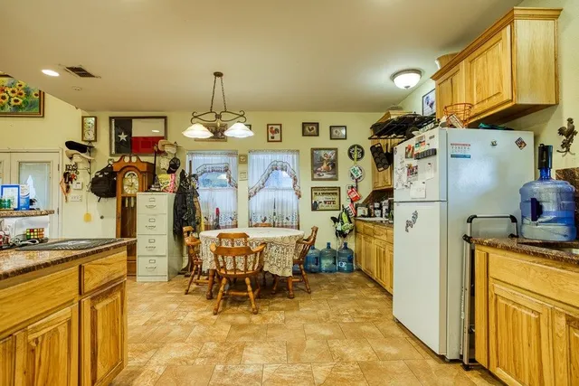 a view of a dining room and kitchen