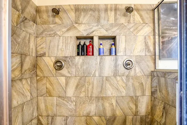 a white bath tub sitting in a bathroom