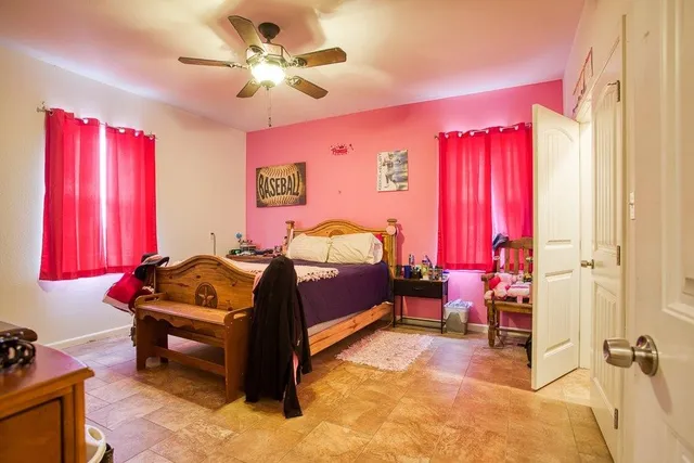 a bed room with a bed and a television