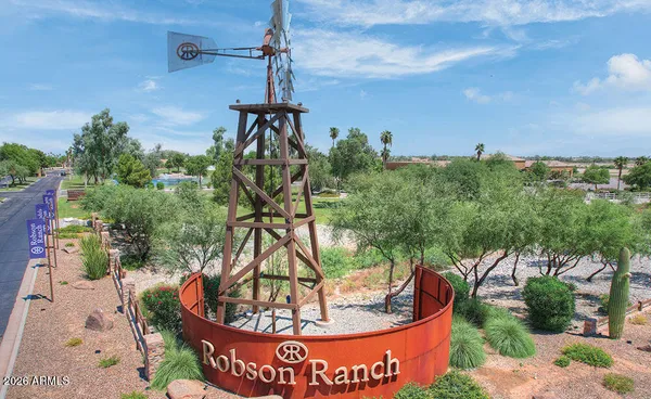 a view of yard with swimming pool and green space