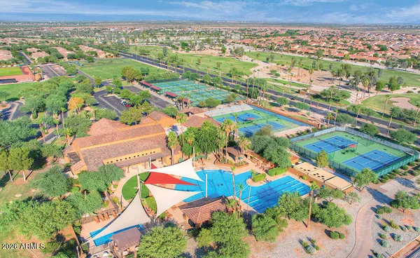 a view of a swimming pool with outdoor seating