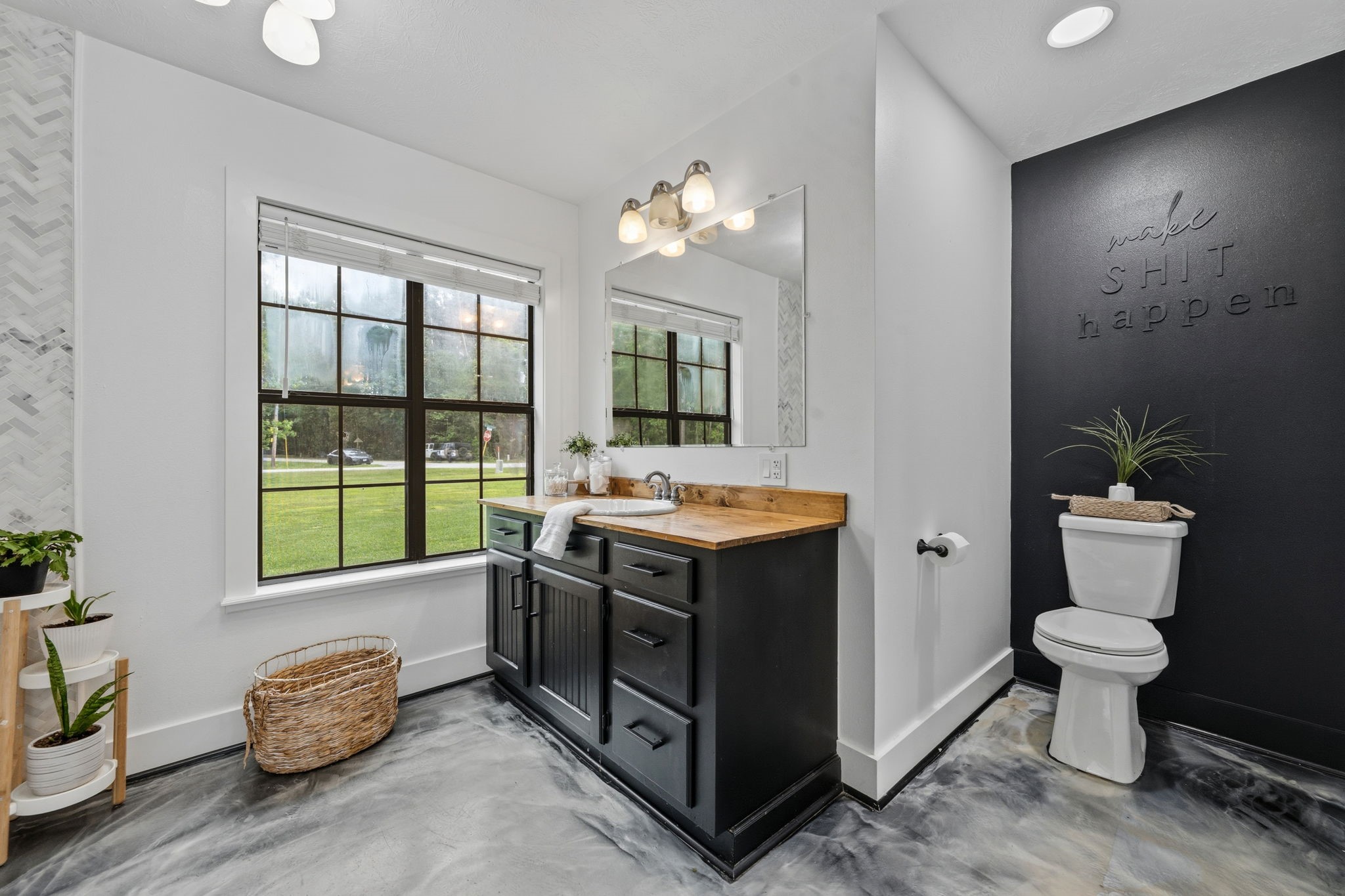 18 East Old Field Road Huffman, TX 77336 - Photo 18 of 35 Spa-inspired primary bath featuring an oversized vanity with abundant storage, designer fixtures, elegant lighting, & expansive windows that fill the space with soft natural light.