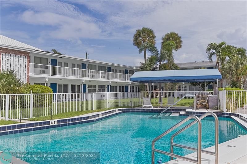 1210 North Riverside Drive, Unit 107 Pompano Beach, FL 33062 - Photo 1 of 29 a view of a house with backyard and sitting area