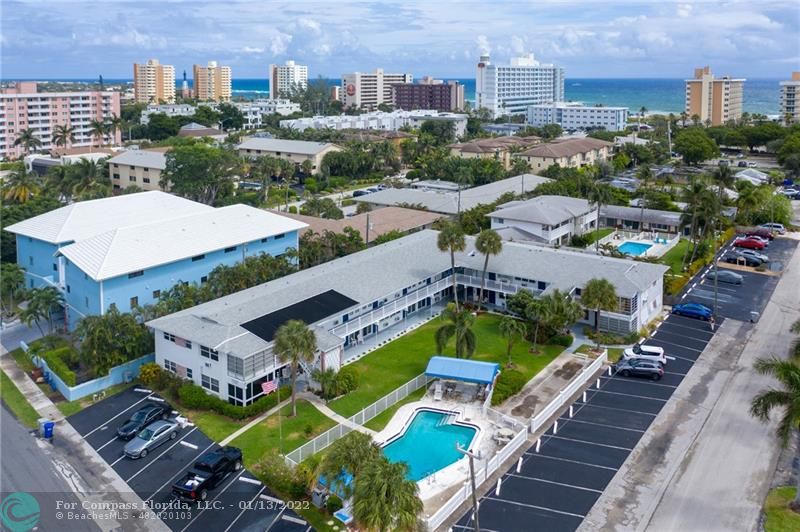 1210 North Riverside Drive, Unit 107 Pompano Beach, FL 33062 - Photo 11 of 29 an aerial view of a house with a big yard