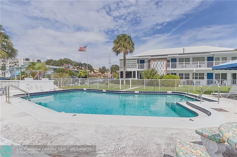 1210 North Riverside Drive, Unit 107 Pompano Beach, FL 33062 - Photo 13 of 29 a view of a swimming pool and a terrace