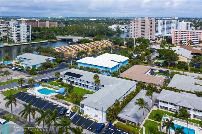 1210 North Riverside Drive, Unit 107 Pompano Beach, FL 33062 - Photo 15 of 29 an aerial view of multiple houses with yard