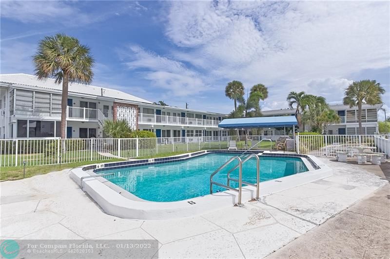1210 North Riverside Drive, Unit 107 Pompano Beach, FL 33062 - Photo 16 of 29 a view of a swimming pool with a patio