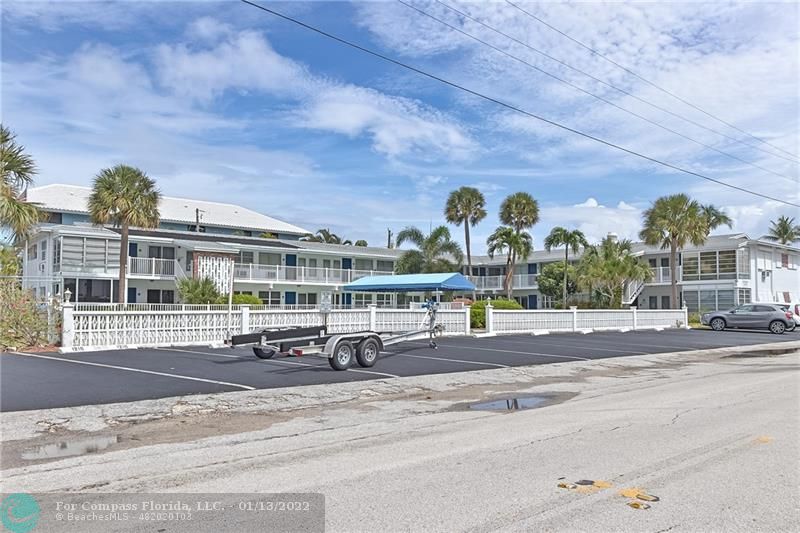 1210 North Riverside Drive, Unit 107 Pompano Beach, FL 33062 - Photo 18 of 29 front view of a building with a street
