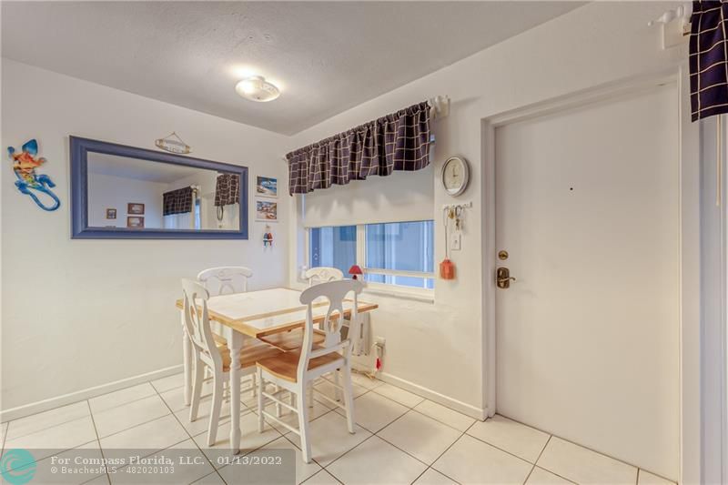 1210 North Riverside Drive, Unit 107 Pompano Beach, FL 33062 - Photo 5 of 29 a view of a dining room with furniture and window
