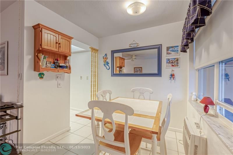1210 North Riverside Drive, Unit 107 Pompano Beach, FL 33062 - Photo 7 of 29 a view of a dining room with furniture