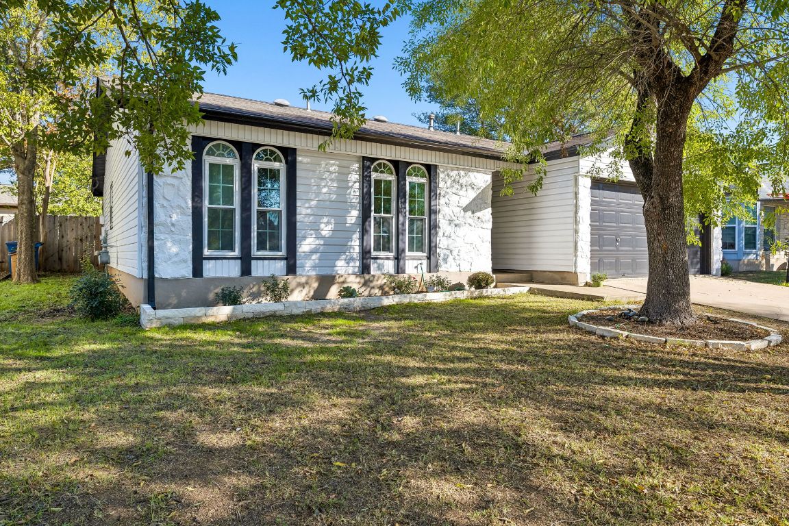 5502 Porsche Lane Austin, TX 78749 - Photo 2 of 32 Ranch-style house with driveway and an attached garage