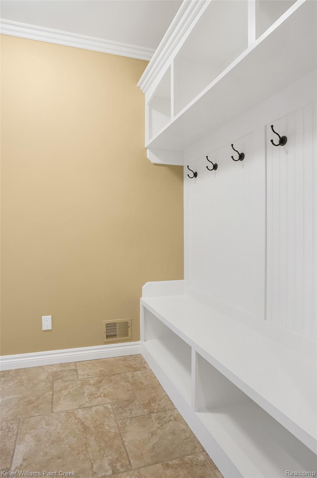 2757 North Addison Circle Rochester, MI 48306 - Photo 33 of 67 The Mudroom is also adjacent to the Command Center and has a built-in coat rack with cubbies for shoes/boots and more storage for other items