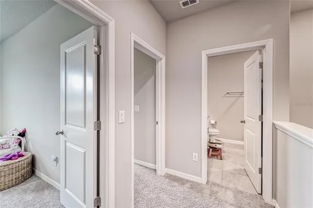 a bedroom with two beds and window