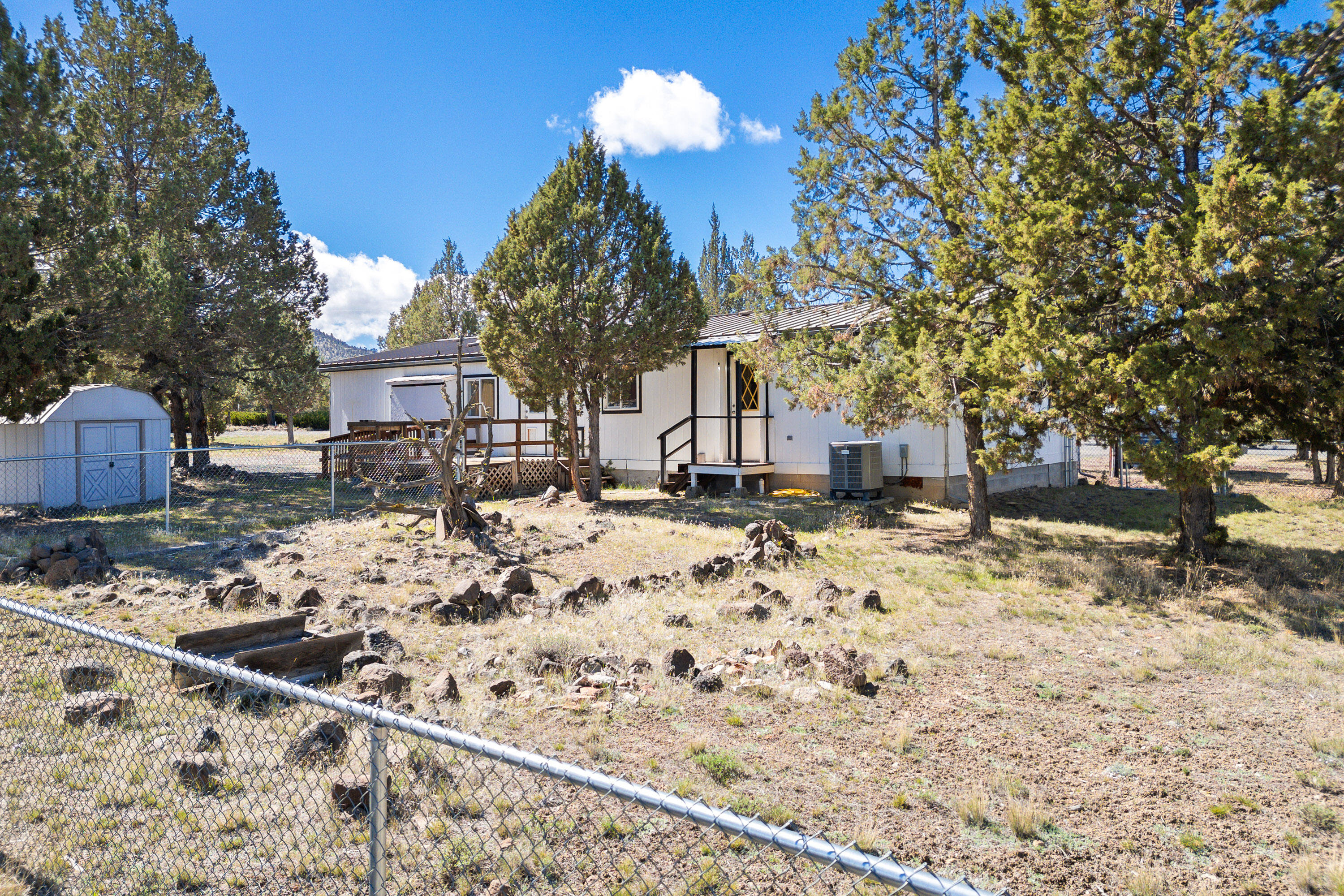 5674 Southeast Davis Loop Prineville, OR 97754 - Photo 34 of 48 a view of a backyard with snow on the road