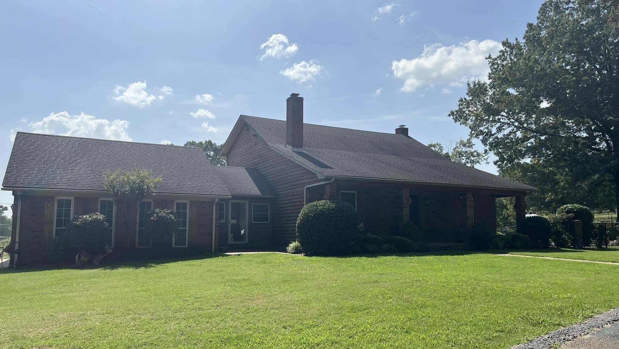 1057 Craig Road Ripley, TN 38063 - Photo 1 of 6 a front view of a house with a yard and garage