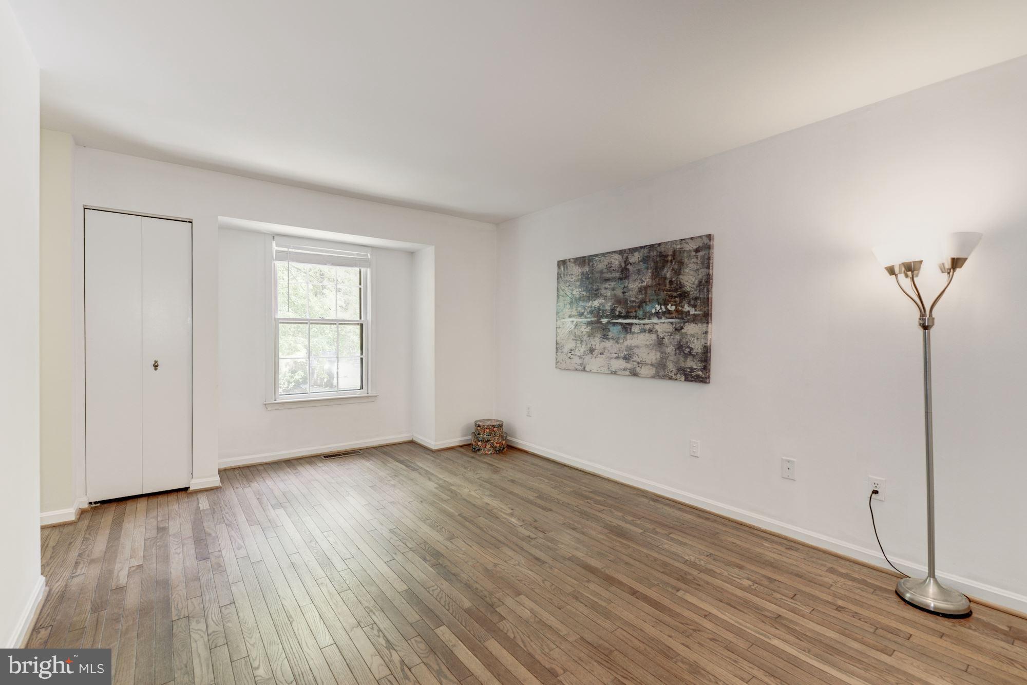 2100 Golf Course Drive Reston, VA 20191 - Photo 12 of 30 an empty room with wooden floor and windows