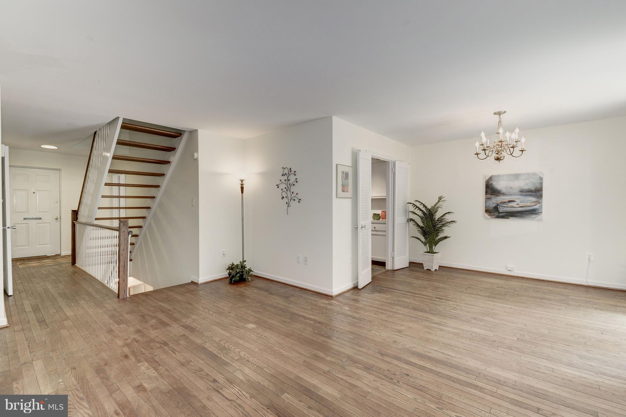 2100 Golf Course Drive Reston, VA 20191 - Photo 3 of 30 an empty room with wooden floor and closet
