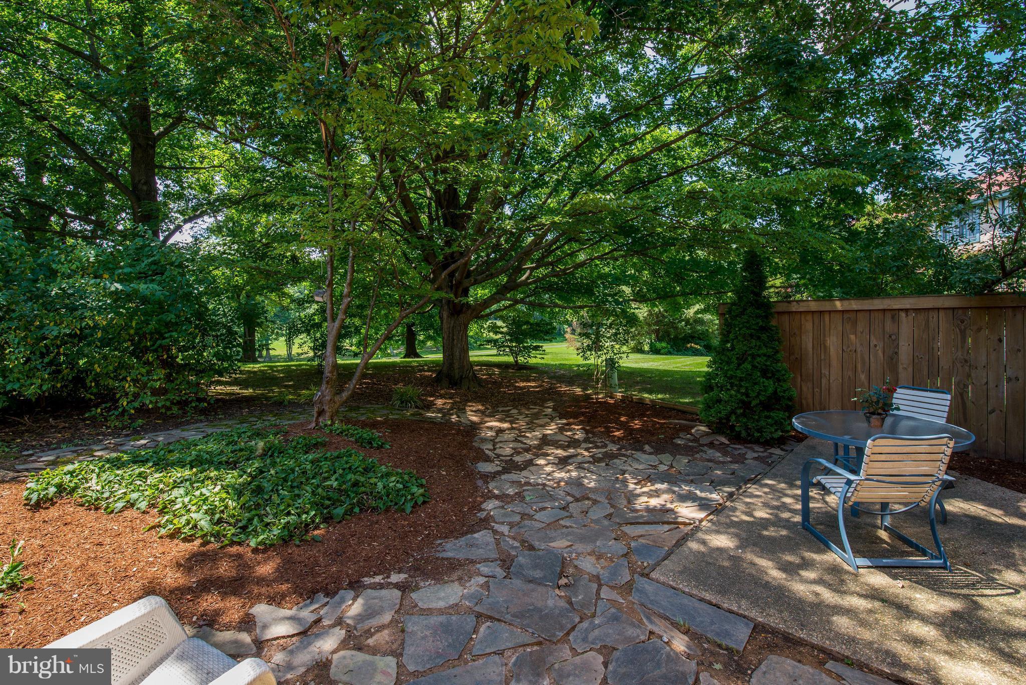 2100 Golf Course Drive Reston, VA 20191 - Photo 21 of 30 a wooden bench sitting in the middle of a park