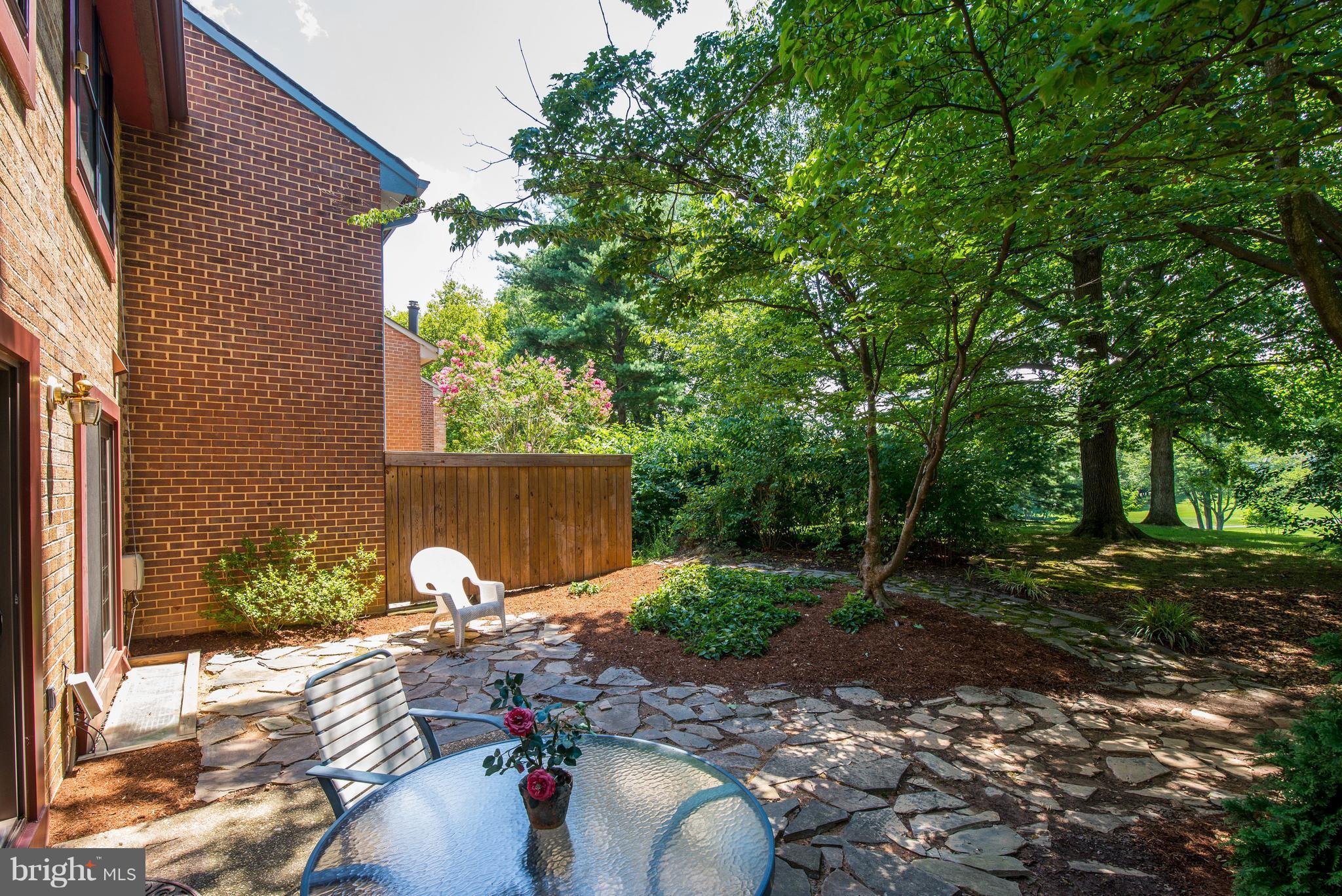 2100 Golf Course Drive Reston, VA 20191 - Photo 22 of 30 a backyard of a house with table and chairs