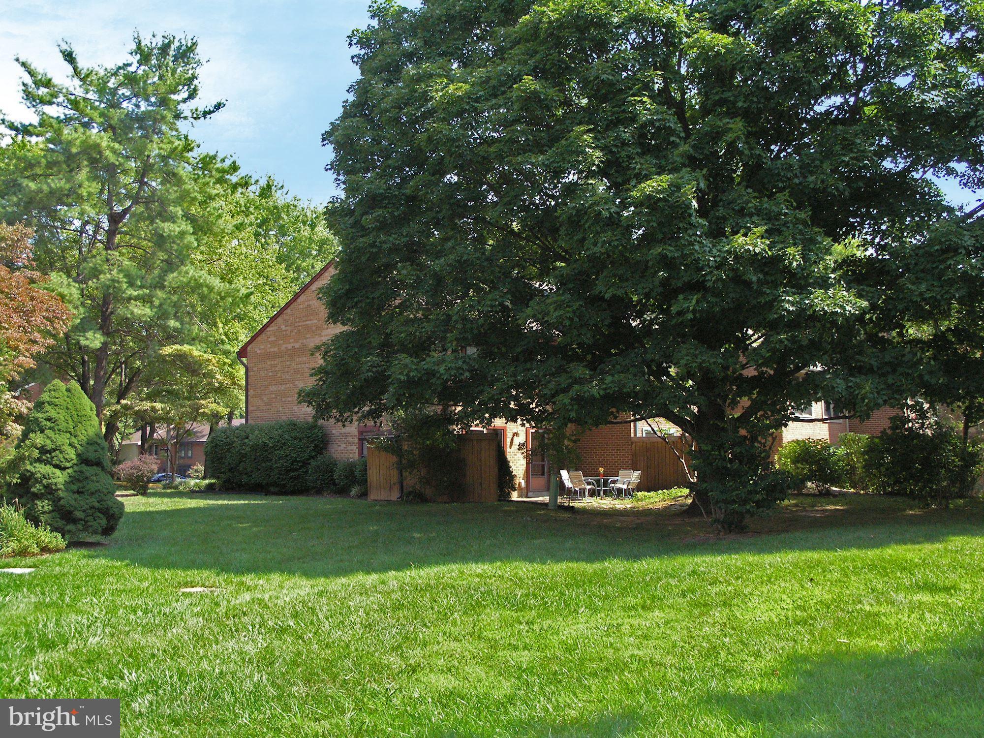 2100 Golf Course Drive Reston, VA 20191 - Photo 25 of 30 a view of a white house with a tree