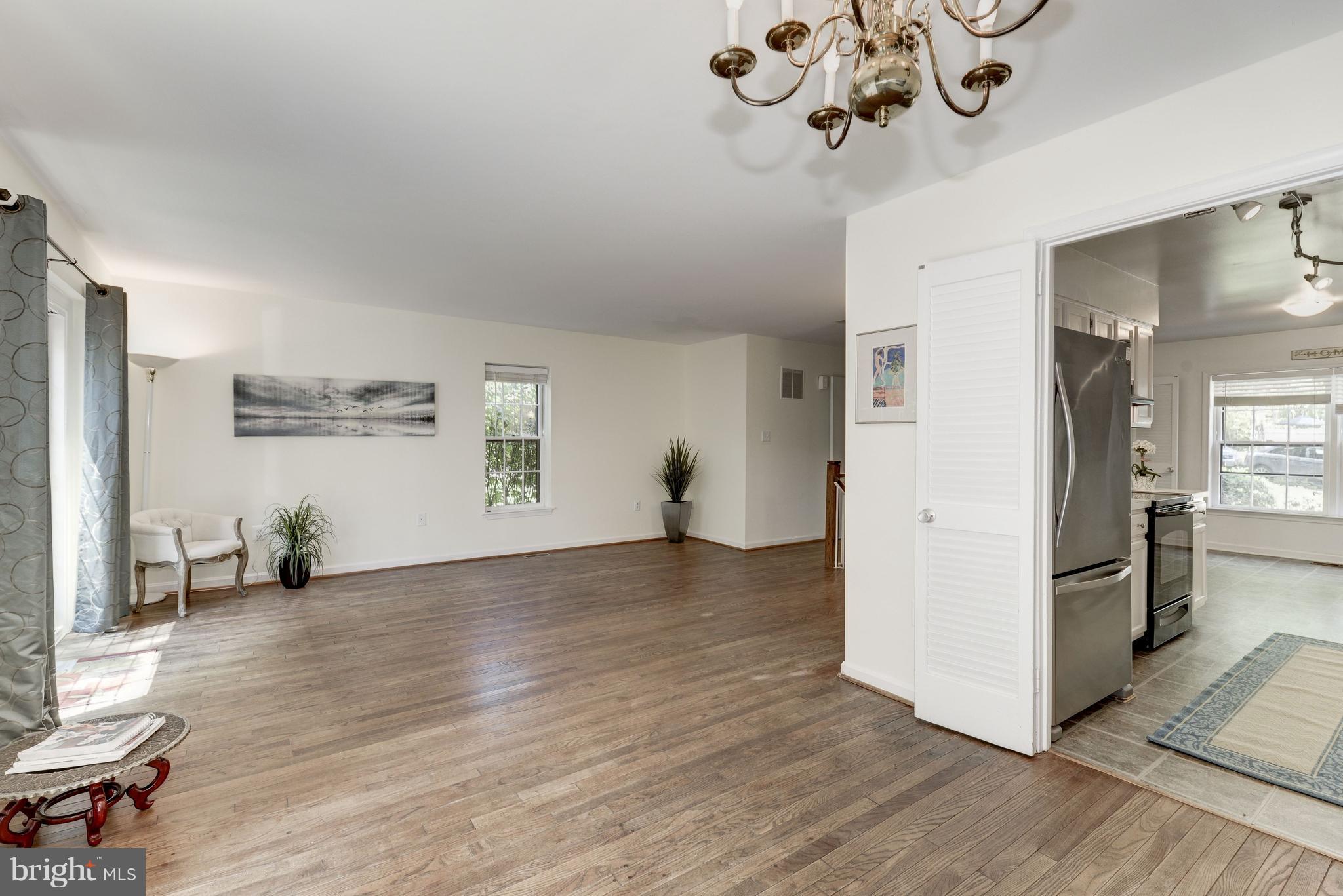 2100 Golf Course Drive Reston, VA 20191 - Photo 6 of 30 a view empty room with wooden floor and windows