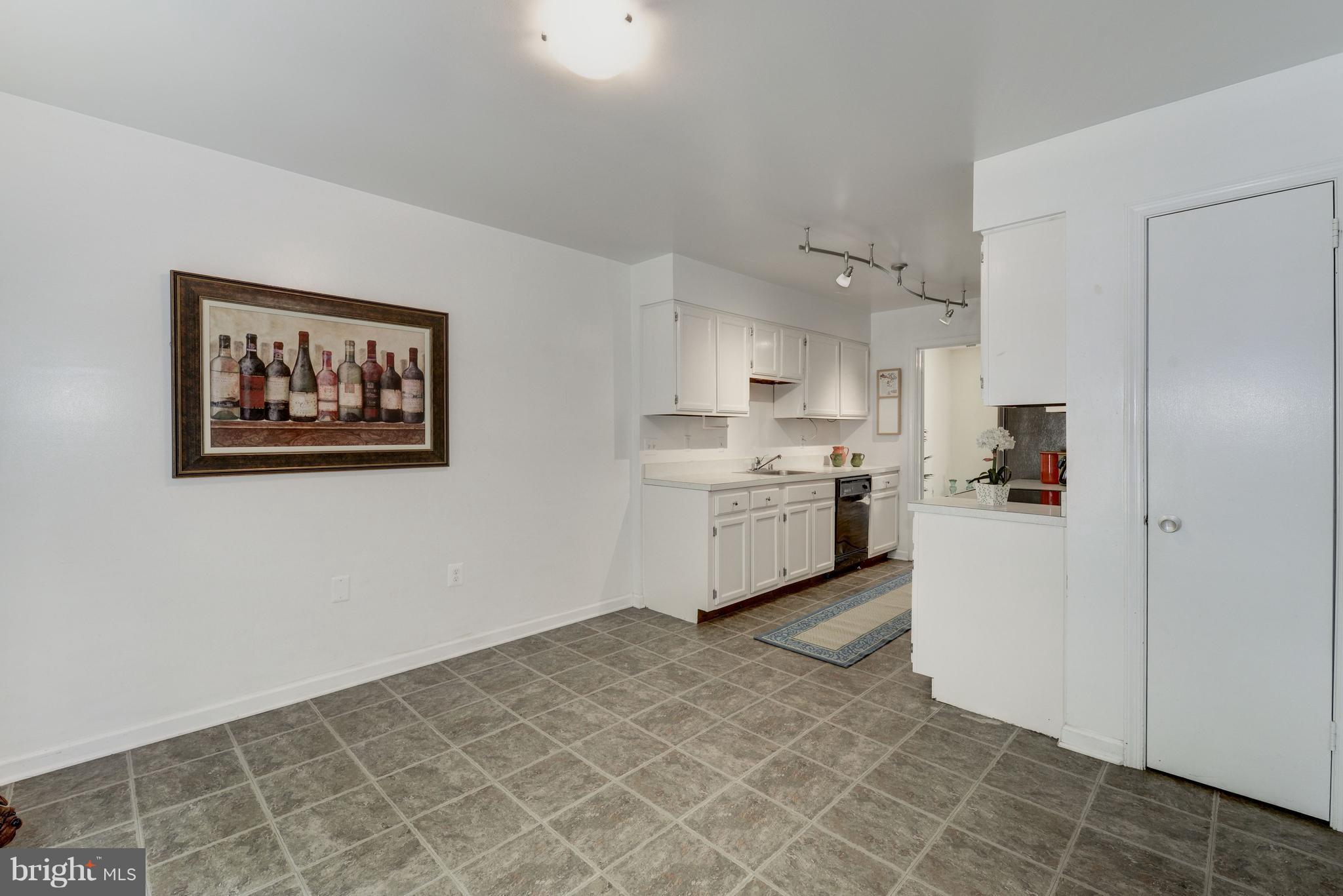 2100 Golf Course Drive Reston, VA 20191 - Photo 10 of 30 a kitchen with a cabinets and white appliances