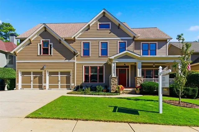 a front view of a house with a yard