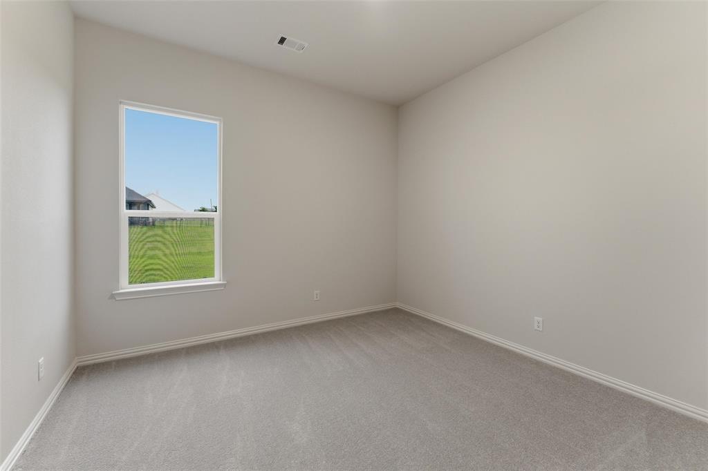 119 Hillview Trail Decatur, TX 76234 - Photo 9 of 30 Interior room featuring neutral wall paint and grey carpeting