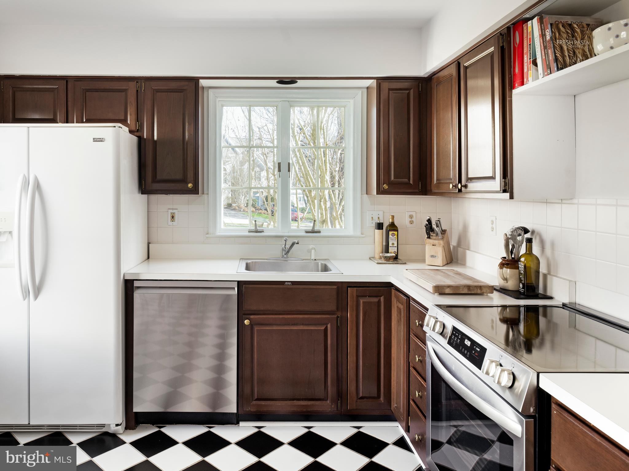 534 Pewter Drive Exton, PA 19341 - Photo 12 of 39 a kitchen with a sink a refrigerator and cabinets