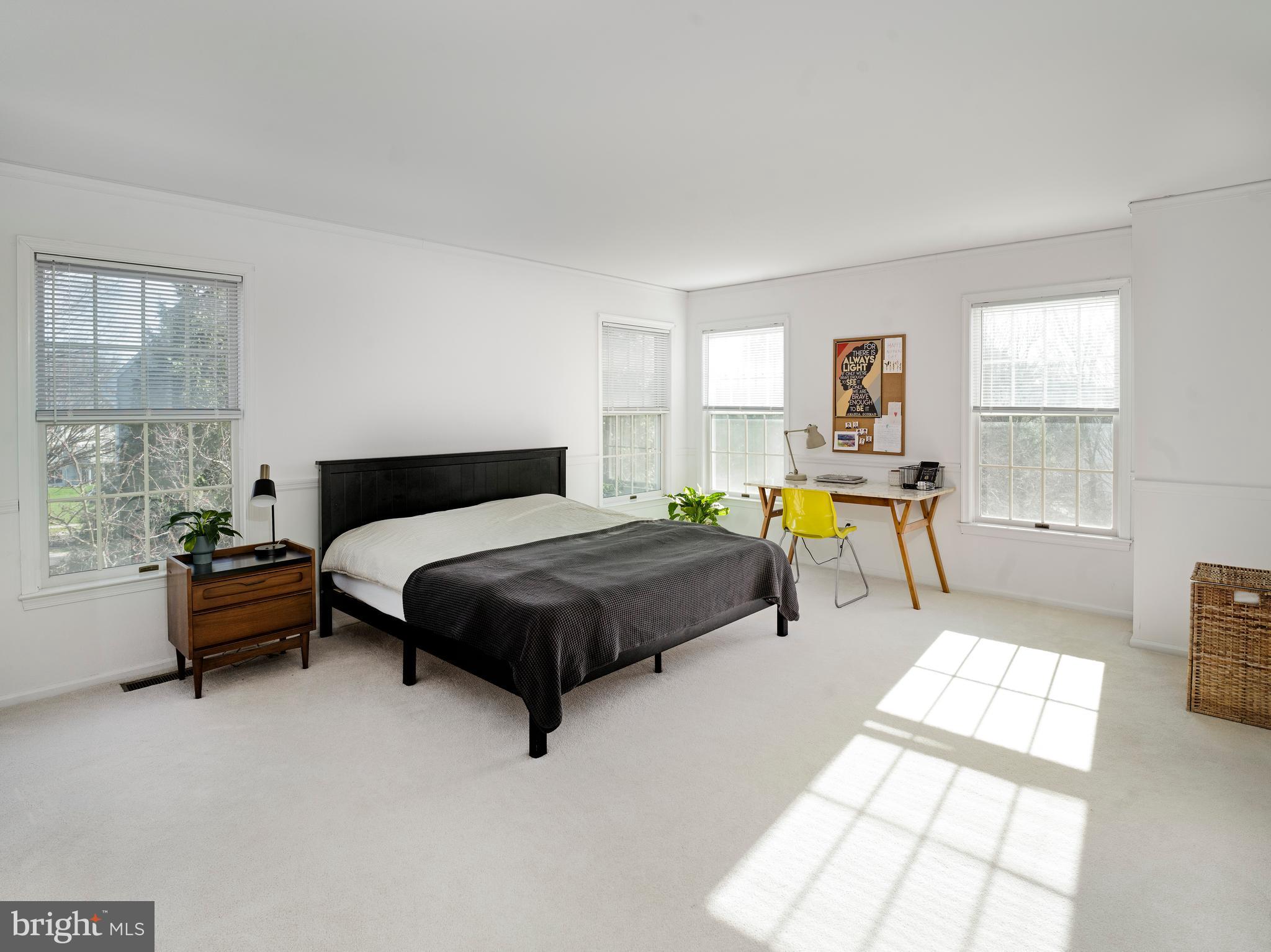 534 Pewter Drive Exton, PA 19341 - Photo 16 of 39 a bedroom with a bed and a table in it