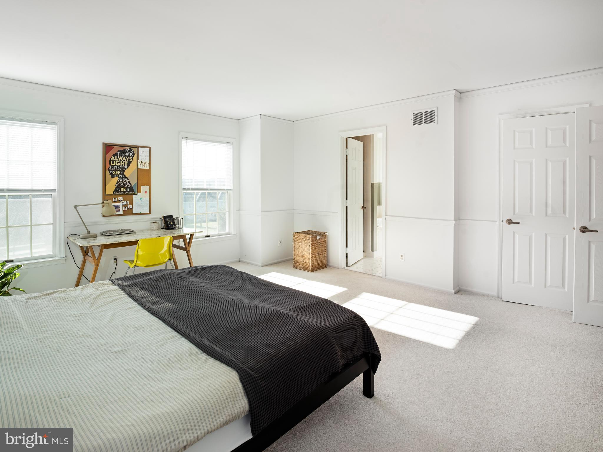 534 Pewter Drive Exton, PA 19341 - Photo 17 of 39 a bedroom with a bed and wooden floor
