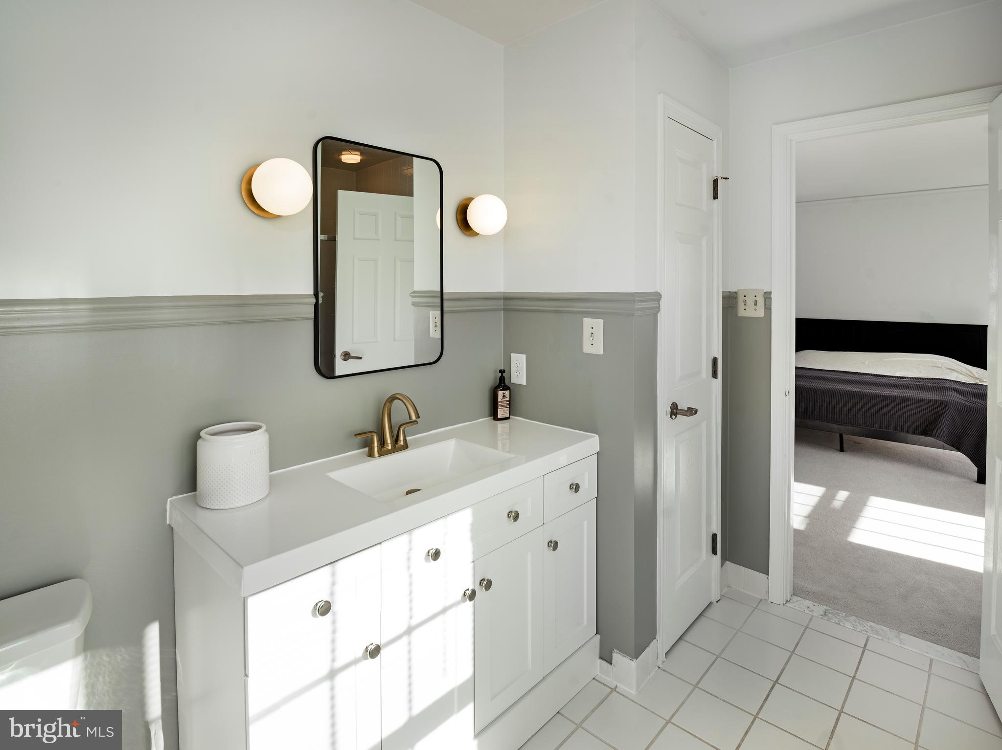 534 Pewter Drive Exton, PA 19341 - Photo 19 of 39 a en suite bathroom with a double vanity sink and a mirror